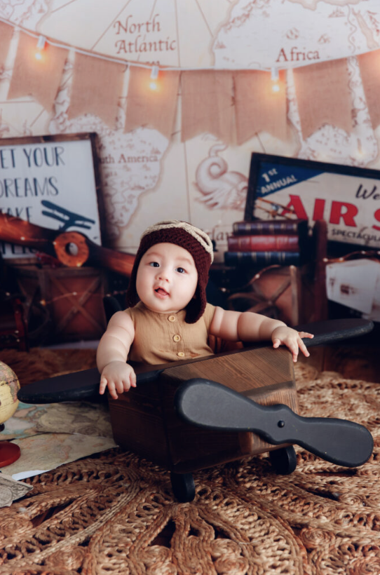 100 days baby photography session with adorable baby smiling in professional studio in Hong Kong